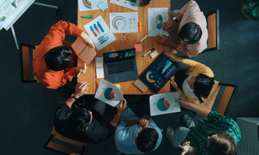 image looking down on a people in a meeting